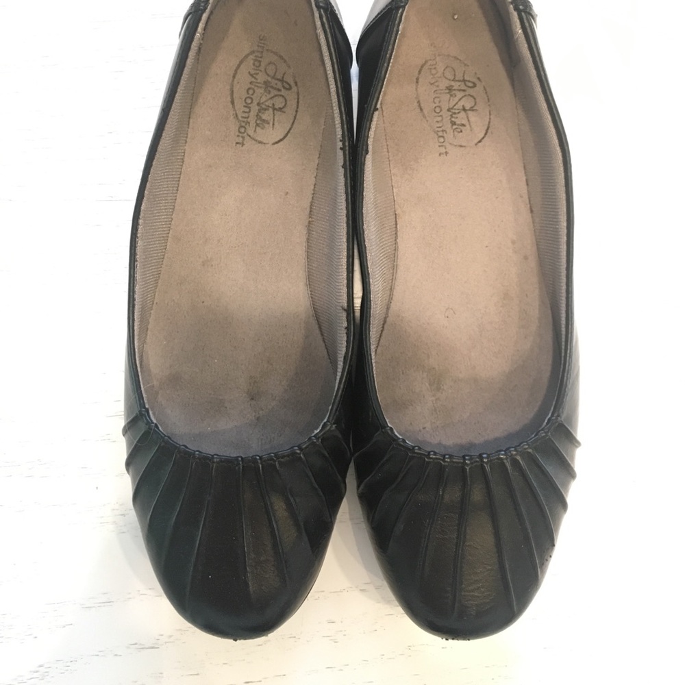Black leather flats